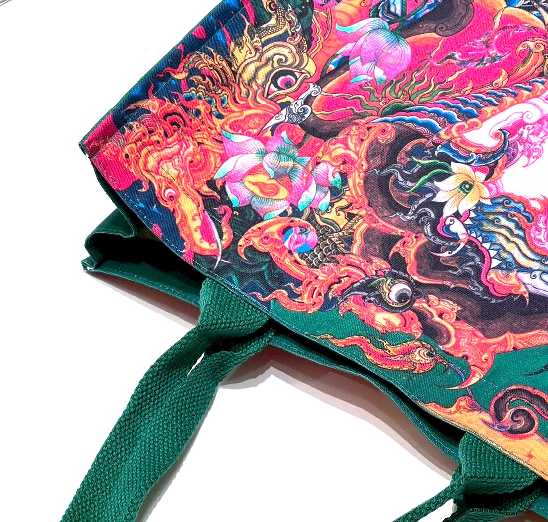green bag with patterns from the "Thepthasutha"