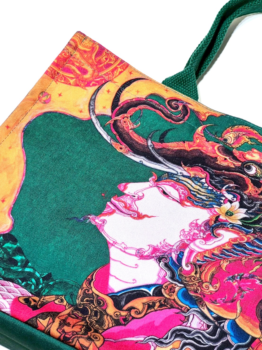 green bag with patterns from the "Thepthasutha"